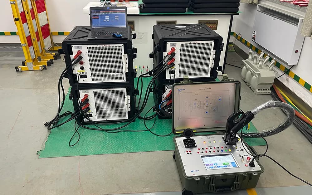 Portable charging diagnostic instrument connected to stacked test loads in a laboratory