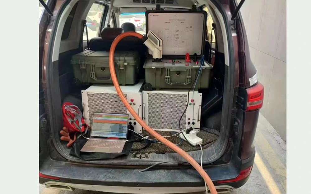 Vehicle carrying portable charging-test instruments, loads and a laptop