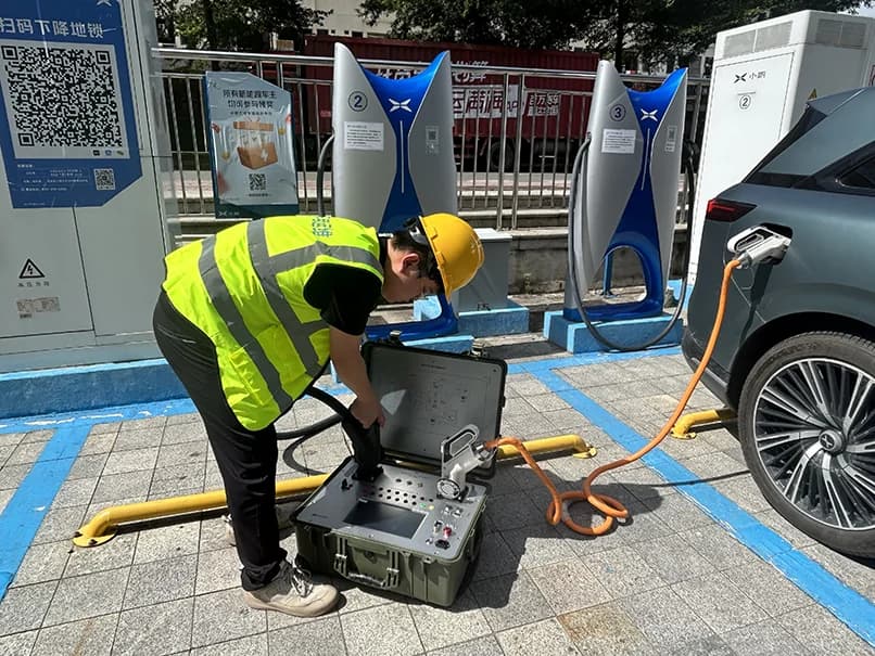 Engineers conducting an EV charger system field test